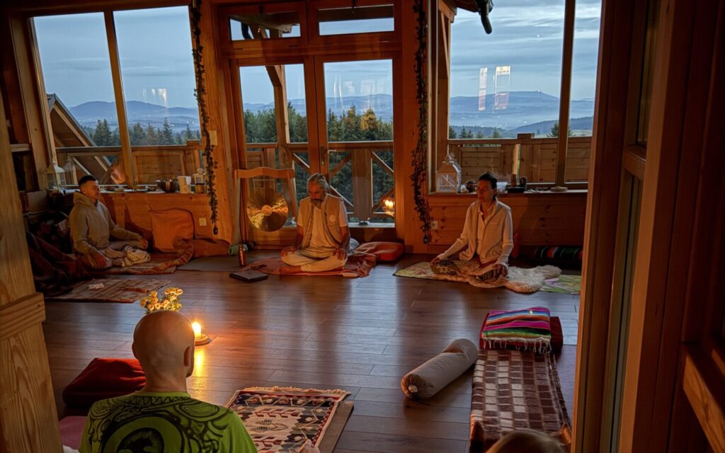 Students practising Kundalini Yoga in the hall at dusk, Oasis of Being