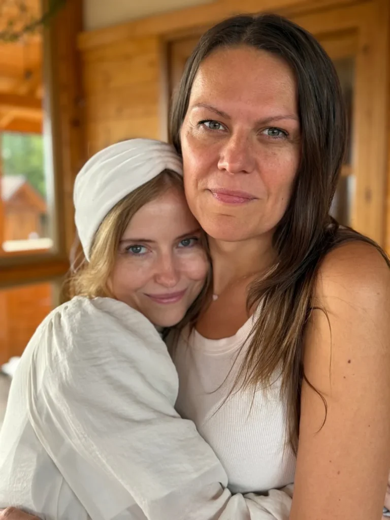 Two participants embracing during a retreat